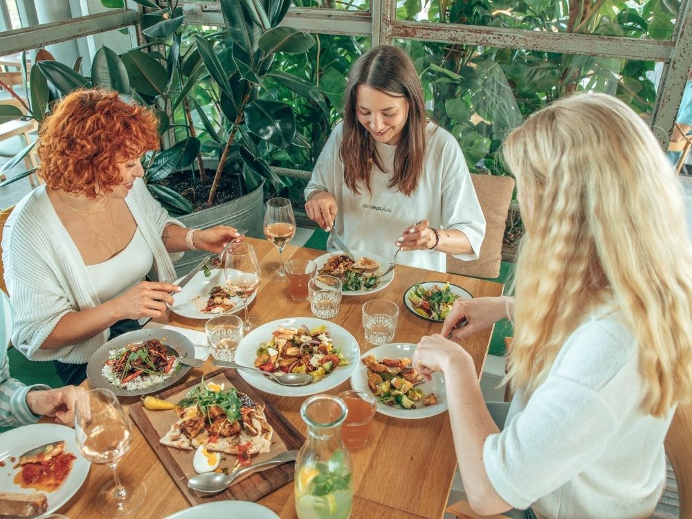 Small group of people sharing Eastern-Mediterranean dishes