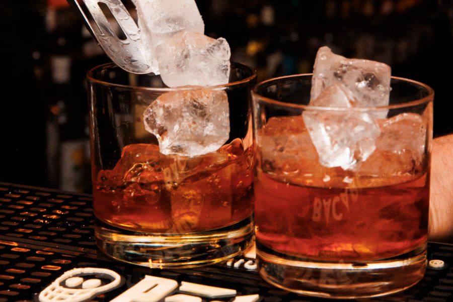 putting ice into the drinks