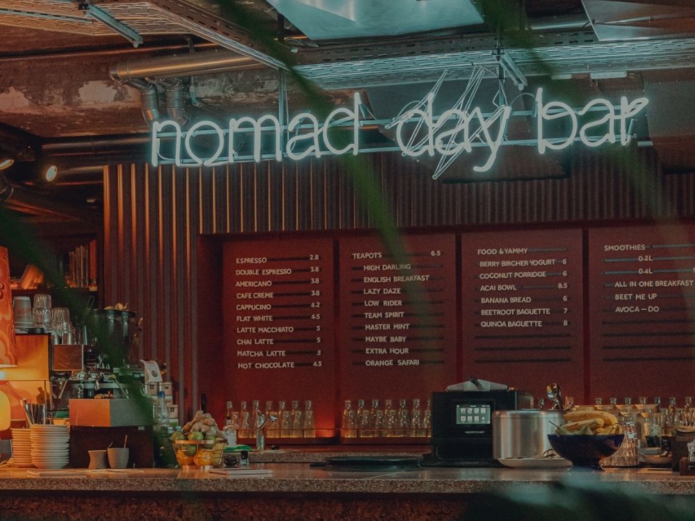 Nomad Day Bar logo and bar area