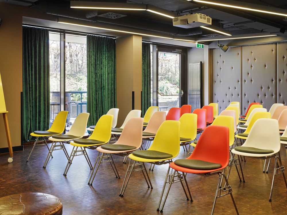 A classroom setting featuring an array of colorful chairs.